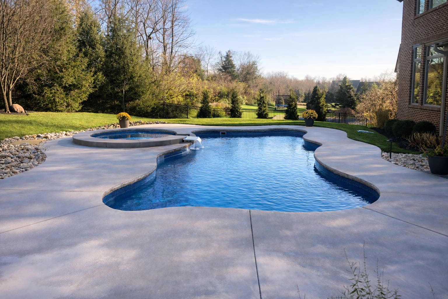 freeform-pool-circular-spa-fountain-feature-fall-backyard