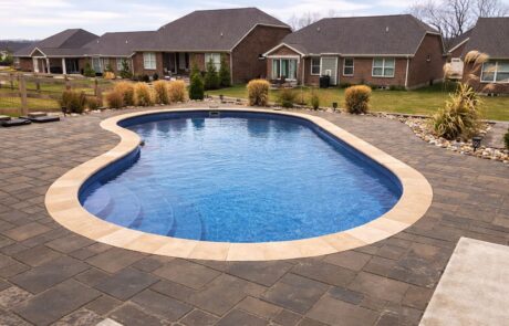 outdoor fiberglass pool in community home